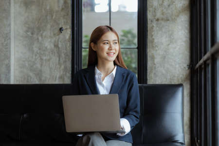 Young Asian women working in the office, young businesswoman founding startup companies, running business by young female executives, business ideas and leadership by female leaders.の写真素材