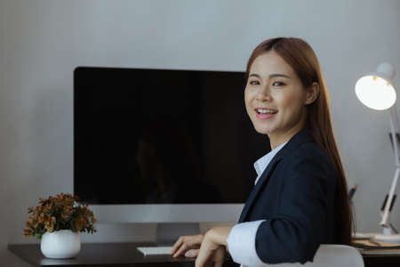 Young Asian women working in the office, young businesswoman founding startup companies, running business by young female executives, business ideas and leadership by female leaders.の写真素材