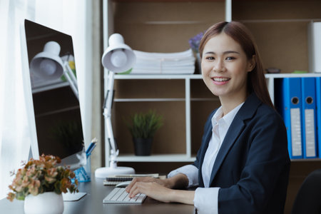 Young Asian women working in the office, young businesswoman founding startup companies, running business by young female executives, business ideas and leadership by female leaders.の写真素材