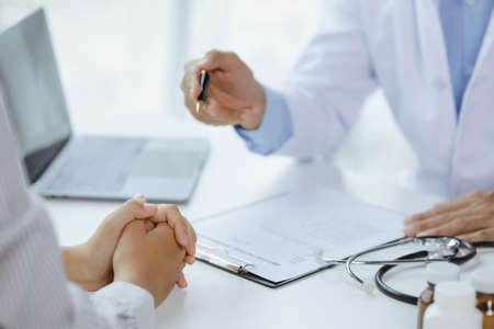 Doctors are giving advice on treatment to patients in hospital examination rooms, treating diseases...