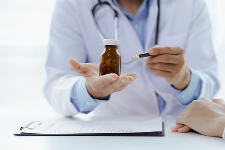 Doctors are giving advice on medication to patients in hospital examination rooms, treating diseases from specialists and providing targeted treatment. Concepts of medical treatment and specialists.の写真素材