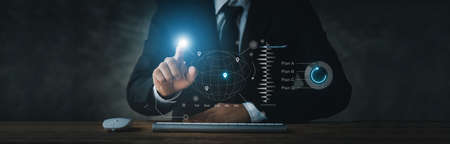 Businessman in formal suit dunking at hologram, digital marketing network icon concept, online...