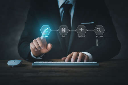 Businessman in formal suit pointing at hologram, digital marketing network icon concept, online...