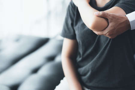 Professional physiotherapists are working to relax the muscles for patients who are treated for muscle disorders, most patients are office workers who sit for a long time causing pain. office syndromeの写真素材