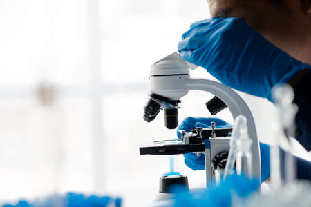 Laboratory assistants are investigating chemical reactions, medical scientists, chemical researchers, chemical experiments and disease testing from patient blood samples. Medicine and research conceptの写真素材