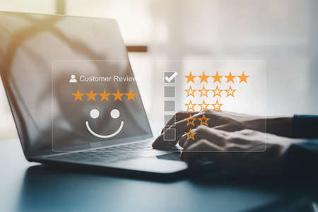 Product or service review ideas from customers, writing reviews from customers who use the products and services of the store to express their satisfaction and increase the credibility of the store.の写真素材