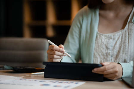 Beautiful Asian woman is a businesswoman who leads a new generation of startups, a woman who runs and manages a business plan to build confidence and stability in business, woman-led business concept.の写真素材