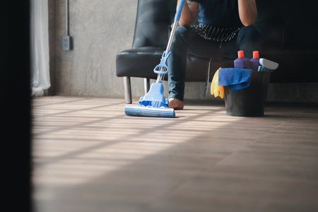 The cleaning equipment bins of the cleaners are placed on the floor. Concept of cleanliness in the organization.の写真素材