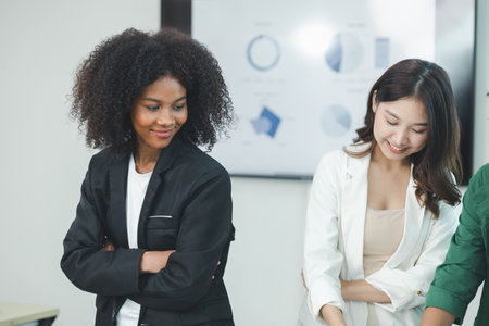 Close-up shot of an American woman attending a conference room at a startup, she is an employee of the International Marketing Department meeting with management and employees to plan a sales boost.の写真素材