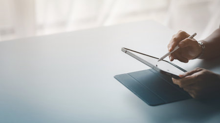 Business men are looking at the company's financial documents on tablets to analyze problems and...