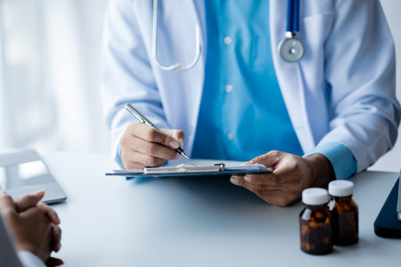 Doctor are recommending medicines to patients after being examined and diagnosed by the patient's doctor, the concept of treatment and symptomatic medication dispensing by the pharmacist.の写真素材
