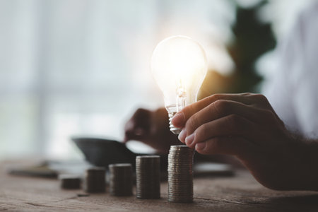 A person is doing a personal account, he calculates salaries, income and expenses for effective financial planning for saving and investing. Concept of accounting for personal income and expenses.の写真素材