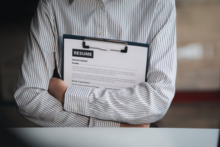 The HR department is reviewing the resumes of job applicants, resumes are important documents for job application. It should contain resume, training history, education, talent, work skills, etc.の写真素材