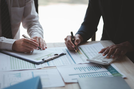 Atmosphere of a startup company meeting, business people are meeting together to summarize and plan investment finances, they are the founders of the company. Business administration concept.の写真素材