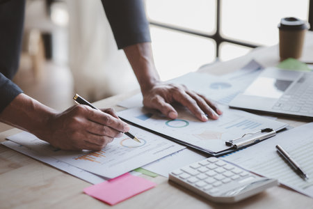 Businessman working, businessman looking at business documents and checking company finances, young startup company executive. Startup business management concept.の写真素材