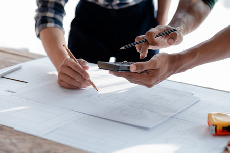 Architects and engineers are working together to edit the draft house plan that was designed after it was presented to the client and partially revised the design. Interior design and decoration ideasの写真素材