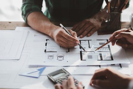 Architects and engineers are working together to edit the draft house plan that was designed after it was presented to the client and partially revised the design. Interior design and decoration ideasの写真素材