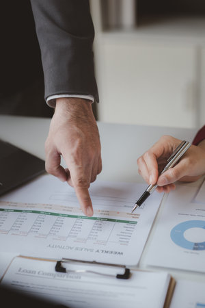 Business man group are meeting together in the office, they are meeting on the topic of finance and...