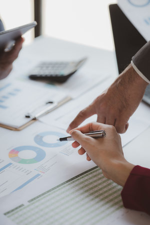 Business man group are meeting together in the office, they are meeting on the topic of finance and...