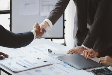 Business man group are meeting together in the office, they are meeting on the topic of finance and financial management, they are business partners. Concept financial management for startup companiesの写真素材