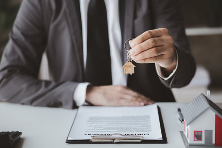 House sales representatives, sales representatives recommend housing details in the project to customers who are interested in viewing the houses in the project. Real estate trading concept.の写真素材