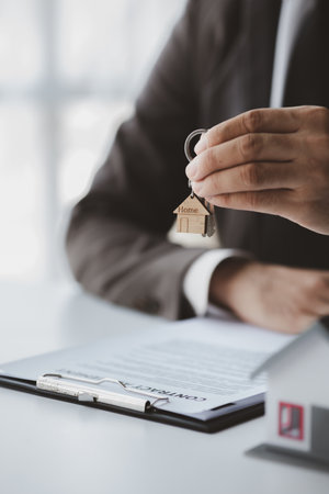 House sales representatives, sales representatives recommend housing details in the project to customers who are interested in viewing the houses in the project. Real estate trading concept.の写真素材