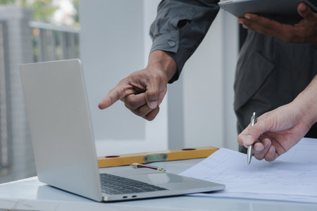 Architects and engineers are working together to edit the draft house plan that was designed after it was presented to the client and partially revised the design. Interior design and decoration ideasの写真素材