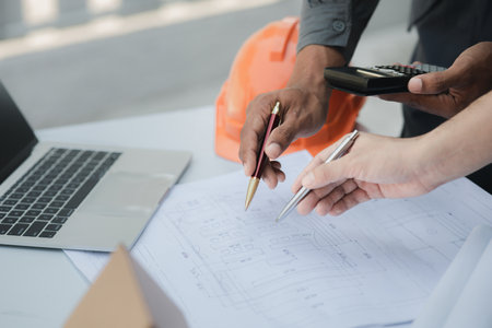 Architects and engineers are working together to edit the draft house plan that was designed after it was presented to the client and partially revised the design. Interior design and decoration ideasの写真素材