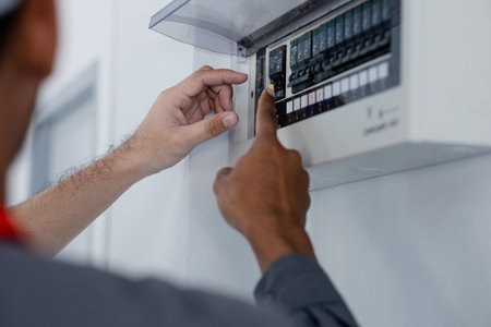 The technician checks the electrical control cabinet in the house to check before delivering the...