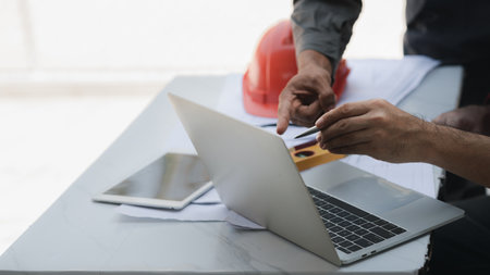 Architects and engineers are working together to edit the draft house plan that was designed after it was presented to the client and partially revised the design. Interior design and decoration ideasの写真素材