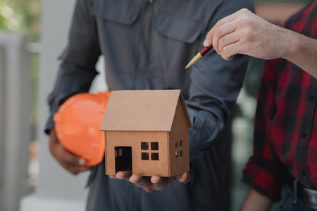 Architects and engineers are working together to edit the draft house plan that was designed after it was presented to the client and partially revised the design. Interior design and decoration ideasの写真素材