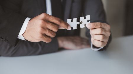 Group business people holding jigsaw puzzle together, Business man group are meeting together in the...