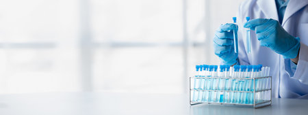 Lab practitioner working on chemical research for chemical reactions, does a chemical experiment and...
