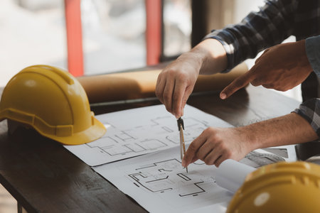 Architects and engineers are working together to edit the draft house plan that was designed after it was presented to the client and partially revised the design. Interior design and decoration ideasの写真素材