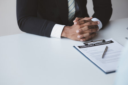 Real estate agents explain models of housing estates in projects to elaborate to clients, explaining and presenting information about homes and purchasing loans. Real estate trading concept.の写真素材