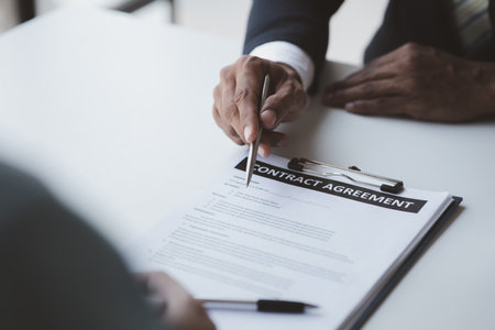 Real estate agents explain models of housing estates in projects to elaborate to clients, explaining and presenting information about homes and purchasing loans. Real estate trading concept.の写真素材