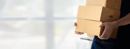 Owner online store on the website, selling products through the website, selling platforms, packing and delivering products according to orders, orders and delivery through private shipping companies.の写真素材