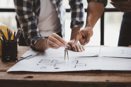 Architects and engineers are working together to edit the draft house plan that was designed after it was presented to the client and partially revised the design. Interior design and decoration ideasの写真素材