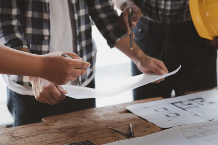 Architects and engineers are working together to edit the draft house plan that was designed after it was presented to the client and partially revised the design. Interior design and decoration ideasの写真素材