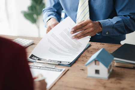 House sales representatives, sales representatives recommend housing details in the project to customers who are interested in viewing the houses in the project. Real estate trading concept.の写真素材