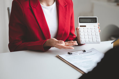 House sales representatives, sales representatives recommend housing details in the project to customers who are interested in viewing the houses in the project. Real estate trading concept.の写真素材