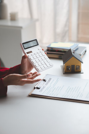 House sales representatives, sales representatives recommend housing details in the project to customers who are interested in viewing the houses in the project. Real estate trading concept.の写真素材