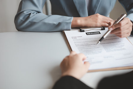 Person submitting resume to interview for a job with a company, Person attending a job interview with a manager to be recruited to the company for the position applied for. Job application concept.の写真素材