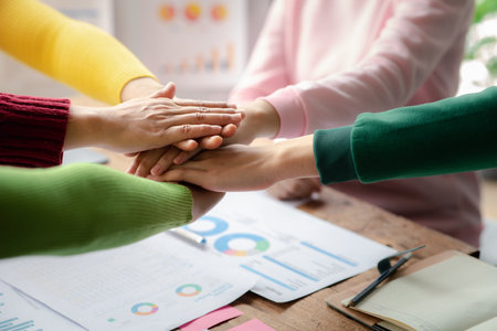 A group of startup businessmen joining hands, business meetings, startup company sales team...