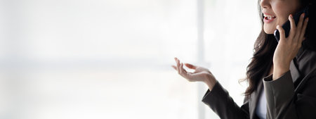 Business woman talking on the phone, young Asian women as executives, founding and running start-up executives, young female business leaders. Startup business concept.の写真素材