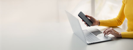 A person holds a mobile phone to use social media on a smartphone, communicating via the Internet on...