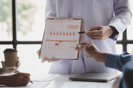 Meeting room in a hospital with a group of doctors attending an informational presentation, a meeting of executive and chief physicians with pharmaceutical dealers. Doctor meeting concept.の写真素材