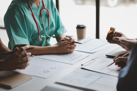 Conference room in the hospital, a group of doctors attending a meeting of drug presentations, a meeting of executive doctors and chiefs meeting with drug dealers. Doctor meeting concept.の写真素材