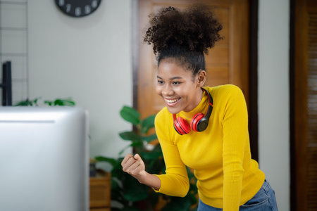 A young American woman is a start-up businesswoman, she in the office, managing and running a...