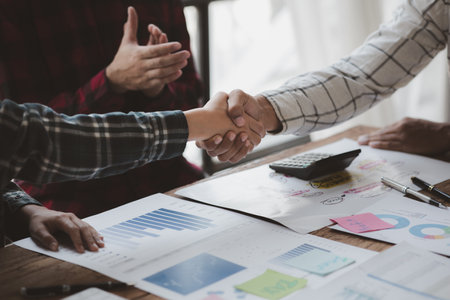 Business dealings and handshakes, startup company marketing team meetings, brainstorming sessions for implementation planning, management by new generations. The idea of opening a startup company.の写真素材